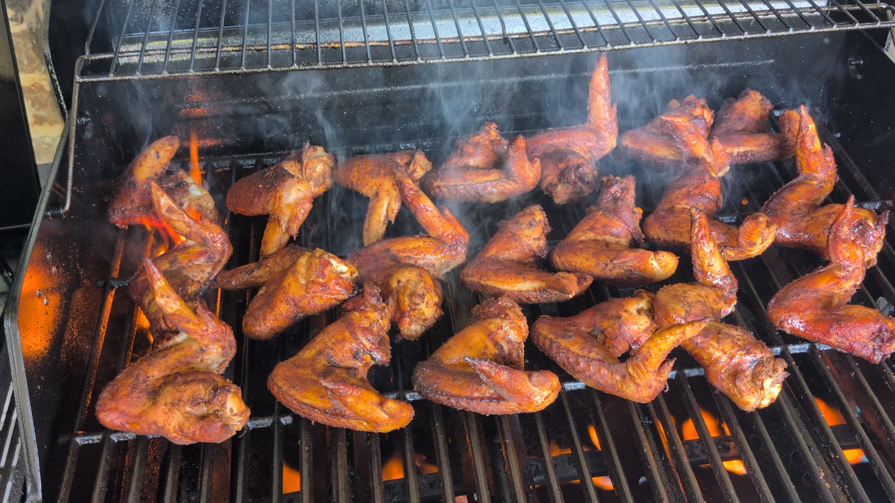 Smoked suya wings over live fire — Texas smoke, Nigerian soul